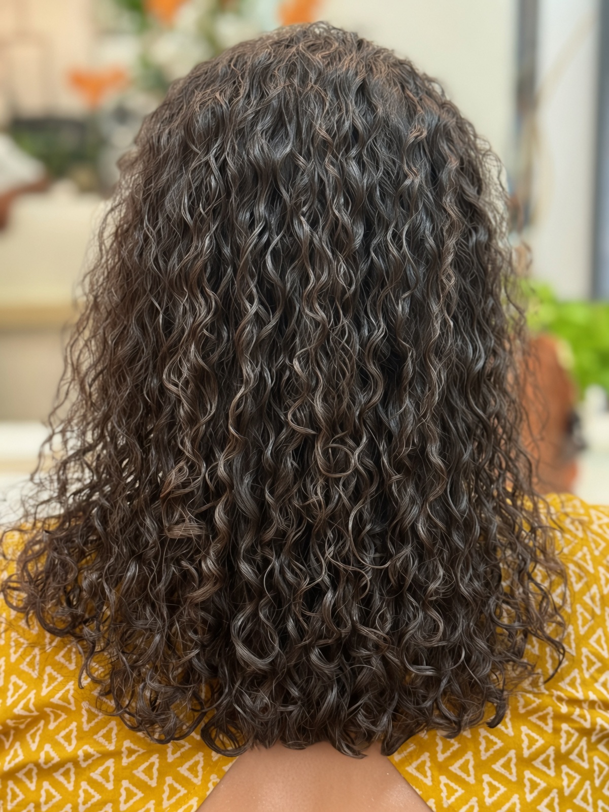 Defined natural-looking curls viewed from the back