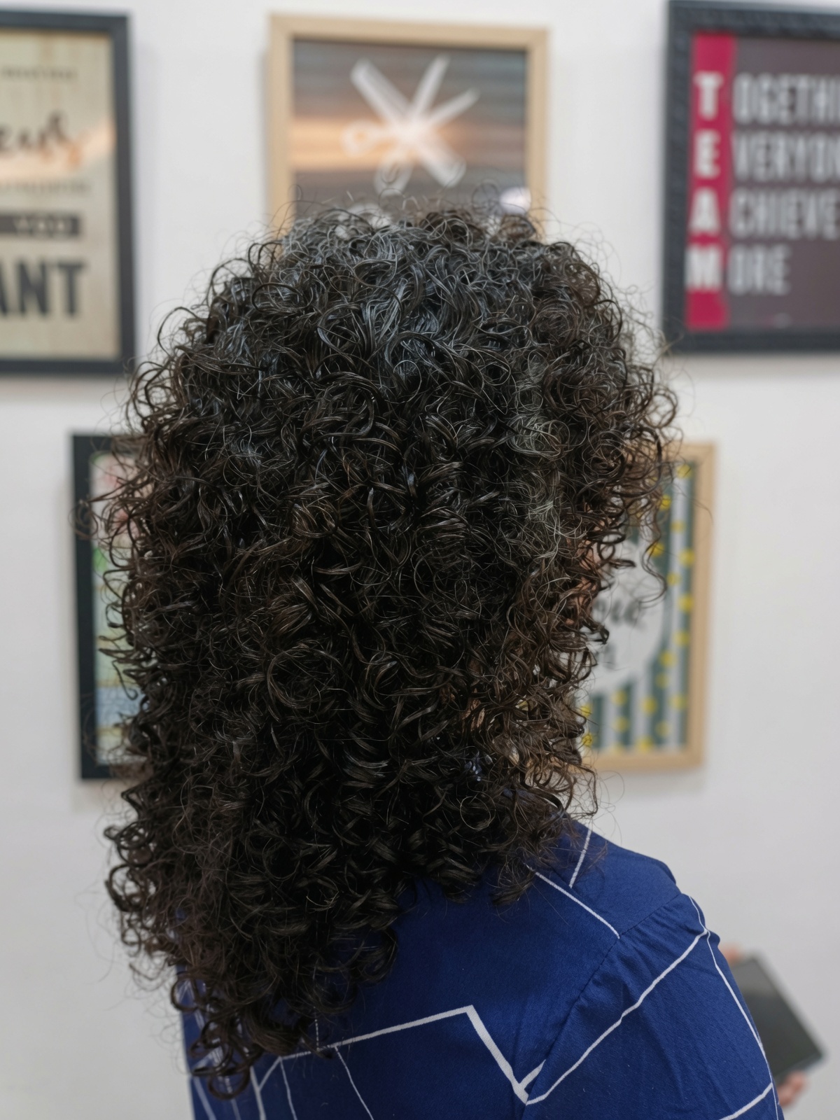 Voluminous glossy curls created at Salon Nayana