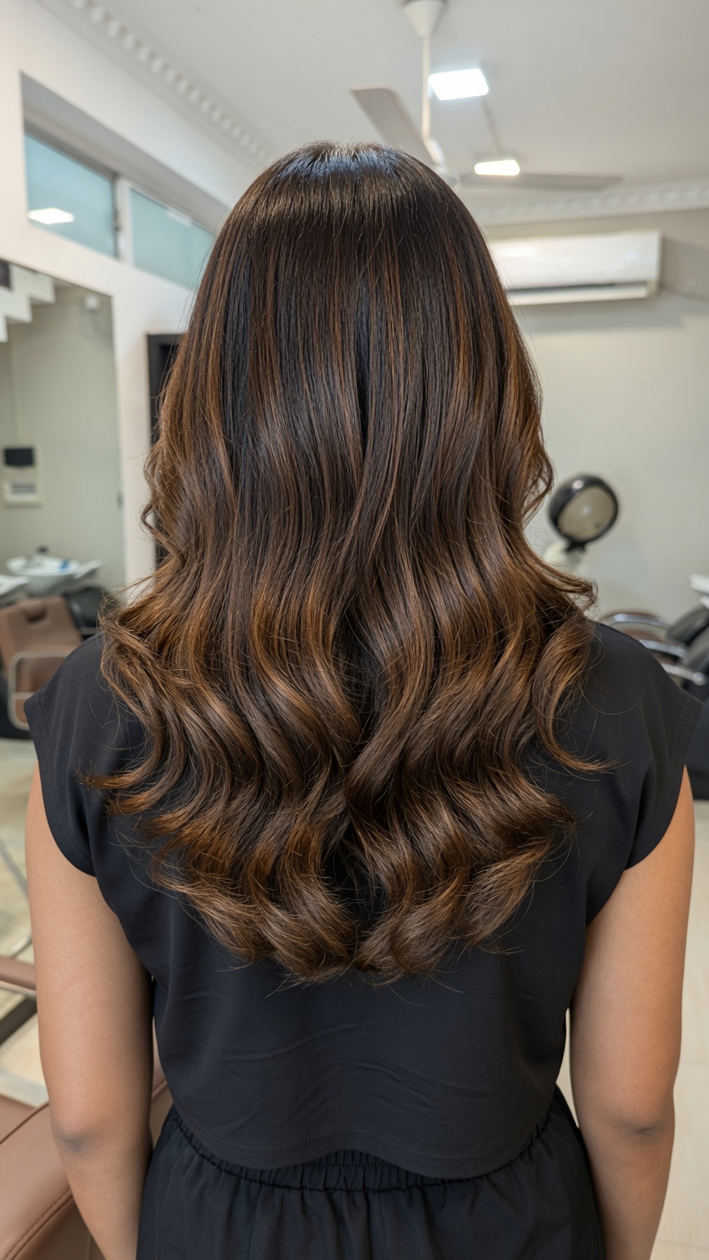 Long layered hair with a polished salon finish
